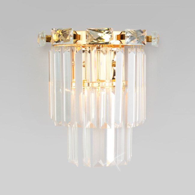 Настенный светильник Eurosvet Elegante 10130/1 золото/прозрачный хрусталь Strotskis a060646 Настенный светильник Eurosvet Elegante 10130/1 золото/прозрачный хрусталь Strotskis a060646
