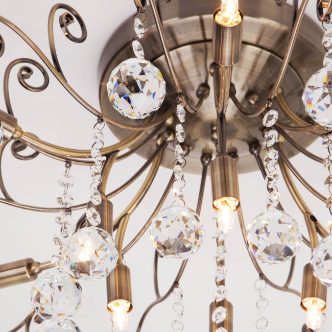 Потолочная люстра Eurosvet 10042/12 античная бронза/прозрачный хрусталь Потолочная люстра Eurosvet 10042/12 античная бронза/прозрачный хрусталь